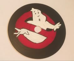 a white ghost on a red and black circle