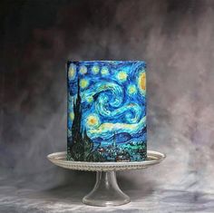 a cake decorated with an image of the starry night painting on top of it