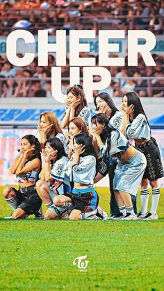 the cheer up team is posing for a group photo in front of an audience at a soccer game