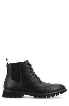 Elevate your work-to-weekend look in this refined faux-leather boot updated by a brogue-detailed wingtip and a heavily lugged sole. 5" shaft Synthetic upper/textile lining/rubber sole Imported Black Brogue Ankle Lace-up Boots, Black Wingtip Lace-up Boots For Fall, Business Wingtip Lace-up Boots With Brogue Detailing, Classic Black Chelsea Boots With Brogue Detailing, Black Ankle Boots With Brogue Detailing, Black Lace-up Boots With Brogue Detailing, Black Wingtip Lace-up Boots For Business, Classic Lace-up Boots With Lug Sole For Workwear, Black Brogue Lace-up Ankle Boots