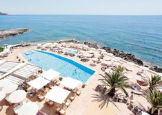 an aerial view of the pool and beach