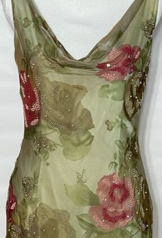 Victoria Royal's women’s beige, green and red, silk sheath dress. SIZE 8 SILK CHIFFON FLORAL MAXI GOWNBEADEDTIERED SKIRTCHIFFON LINING100% SILKDRAPED NECKLINESIDE ZIPPERNew condition, size M (6 - 8). Detailed measurements:Bust - 36 inchesWaist - 30 inchesBody Length - 56 inchesHip - 38 inches Silky Green Dress, Red And Green Aesthetic, Red And Green Outfit, Chiffon Outfit, Beaded Chiffon Dress, Green Silk Dress, Red Floral Maxi Dress, Maxi Floral Dress, 90s Y2k Fashion