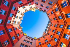 looking up at tall buildings from the ground