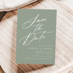 the save the date card is sitting on top of a plate