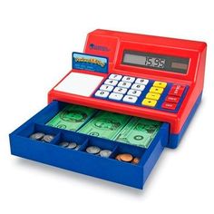 a red and blue toy cash register with money in it