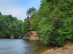 a body of water surrounded by trees and rocks