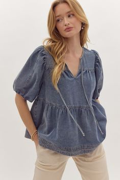 Denim V-neck bubble sleeve tiered top Self tie at front Elastic at cuff 100% cotton WE ONLY OFFER STORE CREDIT FOR RETURNS! items purchased using a discount code {via rewards, text codes, promotions, flash sales, or otherwise} are considered final sale items and are not eligible for store credit and cannot be exchanged. all sale items are final sale and not eligible for return or exchange. Bubble Sleeve Top, School Spirit Wear, Tiered Tops, Zip Dress, Jumpsuits And Romper, Bubble Sleeve, Spirit Wear, Dressy Tops