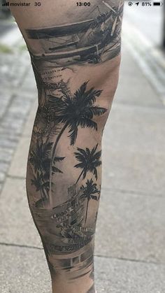 a person with tattoos on their legs walking down the street