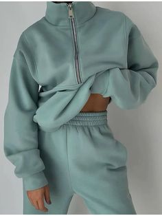 A teal gray sweatsuit with matching sweatshirt and sweatpants are worn by a woman who is holding up the top to expose her midriff  - Fleece Chic Leisure Suit, Sweatshirt Zipper, Half Zip Sweatshirt, Estilo Chic, Sweatpants Set, Sport Chic, Women Sleeve, Women Set, Zip Sweatshirt