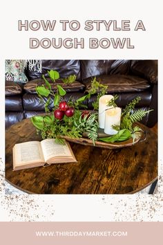 a table with candles and flowers on it that says how to style a dough bowl