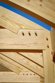 a wooden structure with holes in it