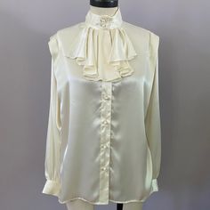 Ivory Peasant Style Blouse Nwt. Covered Buttons. Size 6 Elegant Cream Top With Ruffled Collar, Cream Blouse With Ruffled Collar For Daywear, Elegant Beige Blouse With Ruffled Collar, Elegant Off-white Blouse For Daywear, Elegant Off White Blouse For Daywear, Classic Cream Blouse With Ruffled Collar, Cream Ruffled Top For Formal Occasions, Vintage Cream Blouse For Formal Occasions, Long Length Blouse