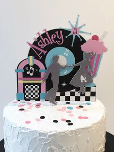 a birthday cake with an image of a dancing couple on it's frosting