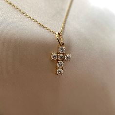 This stunning cross pendant is studded with moissanite surrounded by 14k solid yellow gold. Moissanite is one of the most durable substances on earth and is highly scratch resistant - making it perfect for daily wear. It is known to boost energy and awaken the wearer's hidden potential. It is an April birthstone and people also often attribute love and romance to this gemstone. Moreover, it's believed to bring luck to life. It is a minimal yet classy handmade holy cross pendant, making it a perf Gold Cross Necklace With Prong Setting, Cubic Zirconia Cross Necklace For Gift, Brilliant Cut Cubic Zirconia Cross Necklace As Gift, Diamond Cross Necklace With Brilliant Cut For Gift, Diamond Cross Necklace With Brilliant Cut As Gift, Gift Diamond Cross Necklace With Brilliant Cut, Gold Necklace With Cross Pendant In Prong Setting, Diamond White Brilliant Cut Cross Necklace Gift, Diamond White Brilliant Cut Cross Necklace As Gift