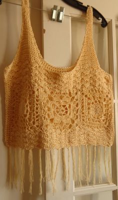 a crocheted bag hanging from a hook