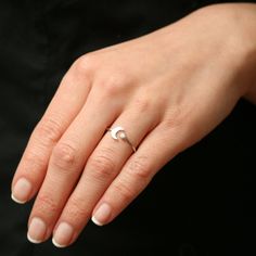 a woman's hand with a ring on it