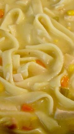 a close up view of some noodles and carrots