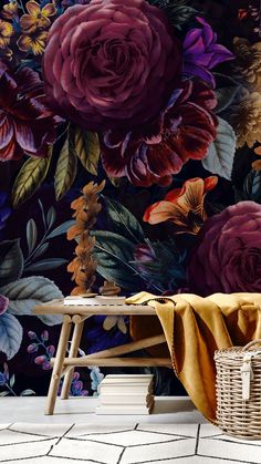 a large flowered wallpaper with purple flowers and leaves on it, next to a wooden bench