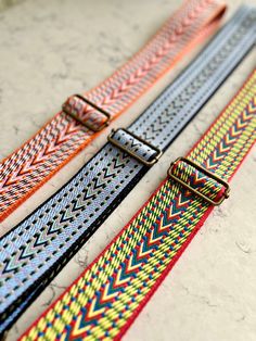 "These colourful webbing straps make it easy to change the look of your favourite bag, just clip them on to a bag that has D rings and you're done!   Lightweight, durable and comfortable to wear over the shoulder, these arrow weave webbing straps are made from 2\" (50mm) wide polyester and come in three different colours.  The strap hardware is antique brass effect.   The length can be easily adjusted with the slider to suit your preferred length. Length of strap when fully extended 51.5\" (131c Summer Multicolor Detachable Bag Strap, Adjustable Multicolor Bag Strap For Summer, Adjustable Multicolor Detachable Bag Strap, Adjustable Multicolor Bag Strap For Everyday Use, Summer Adjustable Bag Strap, Summer Detachable Rectangular Bag Strap, Everyday Multicolor Long Bag Strap, Multicolor Detachable Strap Bag Strap For Everyday, Adjustable Multicolor Shoulder Strap For Everyday Use