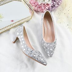 Category:Wedding Shoes,Pumps; Upper Materials:PU; Embellishment:Rhinestone,Crystal,Sparkling Glitter; Heel Type:Stiletto; Gender:Women's; Toe Shape:Pointed Toe; Type:Wedding Heels,Bridal Shoes,Bridesmaid Shoes; Style:Cute,Minimalism,Business,Sexy; Heel Height(inch):2-3; Outsole Materials:Rubber; Occasion:Party; Closure Type:Loafer; Pattern:Geometric,Polka Dot; Listing Date:12/14/2023; Production mode:Self-produce; 2024 Trends:Ladies Shoes Valentines Gifts; Foot Length:; Foot Width:; Size chart date source:Provided by Supplier. Wedding Shoes With Rhinestones And Round Toe, Banquet Wedding Shoes With Rhinestones And Round Toe, Silver Embellished Heels For Banquet, Closed Toe Wedding Shoes With Rhinestones, Closed Toe Heels With Rhinestones For Banquet, Crystal High Heels For Wedding, Wedding Heels With Bling And Pointed Toe, Bling Heels With Pointed Toe For Wedding, Crystal Wedding Shoes With Rhinestones For Prom