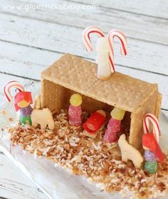 a gingerbread house with candy canes and candies