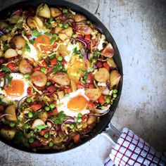 a skillet filled with eggs and vegetables