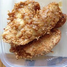 two pieces of fried food in a plastic container