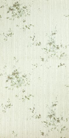 an upholstered fabric with small flowers and leaves on the side, in light green