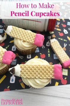 cupcakes with waffle cones and pink icing on top are sitting on a table