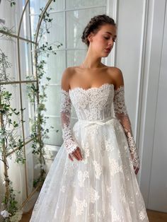 White bridal A-Line gown with long off the shoulders sleeves and embroidery Timeless Gown, Gown With Cape, Teuta Matoshi, Lace Cape, Strapless Neckline, Classic Beauty, Cinched Waist, High Neckline, A Line Skirt