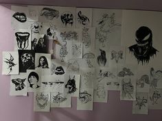 a bunch of drawings are hanging on the wall