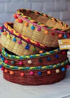 several woven baskets stacked on top of each other