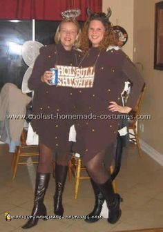 two women dressed in costumes posing for the camera