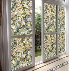 an open window with stained glass flowers on it