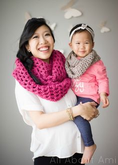 a woman holding a baby in her arms