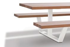 two wooden benches sitting next to each other on top of a white floor with blue legs