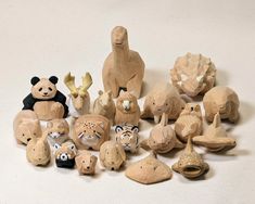 a group of wooden animal figurines sitting next to each other