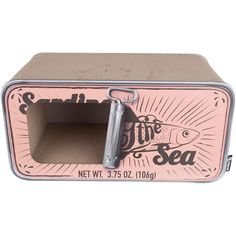 a pink and silver metal box with an open door on the inside that says live in the sea