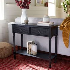 a living room scene with focus on the end table and sofa in the background,