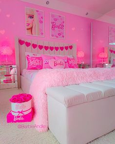 a bedroom decorated in pink and white with hearts on the wall