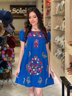 -This Beautiful Floral hand embroidered Dress is the perfect dress to add to your wardrobe. -Its cute enough to dress up for a party or even just wear it to a picnic. -It's lightweight, handmade and hand embroidered by Mexican Artisans in Puebla, Mexico. Traditional Blue Dress With Geometric Embroidery, Blue Fitted Folk Dress, Traditional Blue Dress With Embroidered Sleeves, Peasant Dress With Multicolor Embroidery, Peasant Style Dress With Multicolor Embroidery, Peasant Dresses With Multicolor Geometric Embroidery, Blue Short Sleeve Folk Dress, Fitted Folk Style Blue Embroidered Dress, Traditional Short Sleeve Dress With Intricate Embroidery