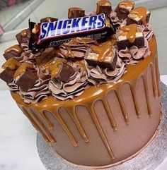 there is a cake with chocolate and peanut butter on top that says sucker's