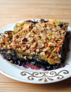 a slice of blueberry pie on a white plate