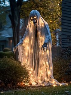 a lighted ghost standing in the yard