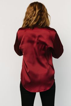 Baltic Born exclusive style Beautiful and classic blouse Lightweight Satin material Rich Burgundy color Collared neckline Faux abalone buttons Single button, rounded cuff Shirttail hemline Marianne is 5'6, cup size 34D, size 6 and wearing size S Collared Blouse With Button Cuffs For Night Out, Classic Blouse With Button Cuffs For Night Out, Fall Blouse With Back Button Closure For Night Out, Fall Night Out Blouse With Button Cuffs, Fall Blouse With Button Closure And Shirttail Hem, Fall Night Out Tops With Button Cuffs, Fall Tops With Button Cuffs For Night Out, Button Back Tops For Workwear In Fall, Button Back Tops For Fall Workwear