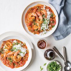 two white bowls filled with shrimp and rice