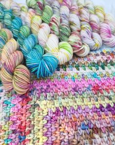 several skeins of multicolored yarn laid out on top of each other