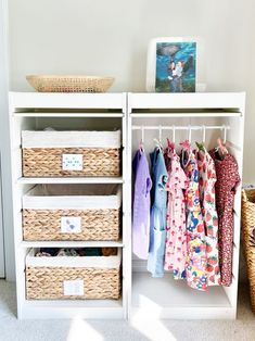 an organized closet with clothes and baskets