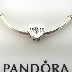 Pandora Pink Mom Heart Charm # 791881PCZ New and never used ALE / S925 on it Sterling Silver Bracelet for display only Pictures taken from actual item Comes with Official Pandora cartoon box,tissue paper and seal PAYMENT: We accept credit cards, debit cards, and e-checks through Etsy payment system. Payment is due within 3 days, but immediate payment is greatly appreciated. SHIPPING: Item available now ready to go I can ship out as soon as possible mostly same day I do combine when you done plea Heart-shaped Sterling Silver Bracelet For Birthday, Sterling Silver Heart Bracelet For Birthday, Silver Heart Bracelet As Gift For Mom, Silver Heart Bracelet Gift For Mom, Silver Heart Charm Bracelet For Mom, Pandora Pink, Bracelet Pandora, Green Rings, Pandora Bracelet Charms