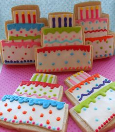 several decorated cookies sitting on top of a table